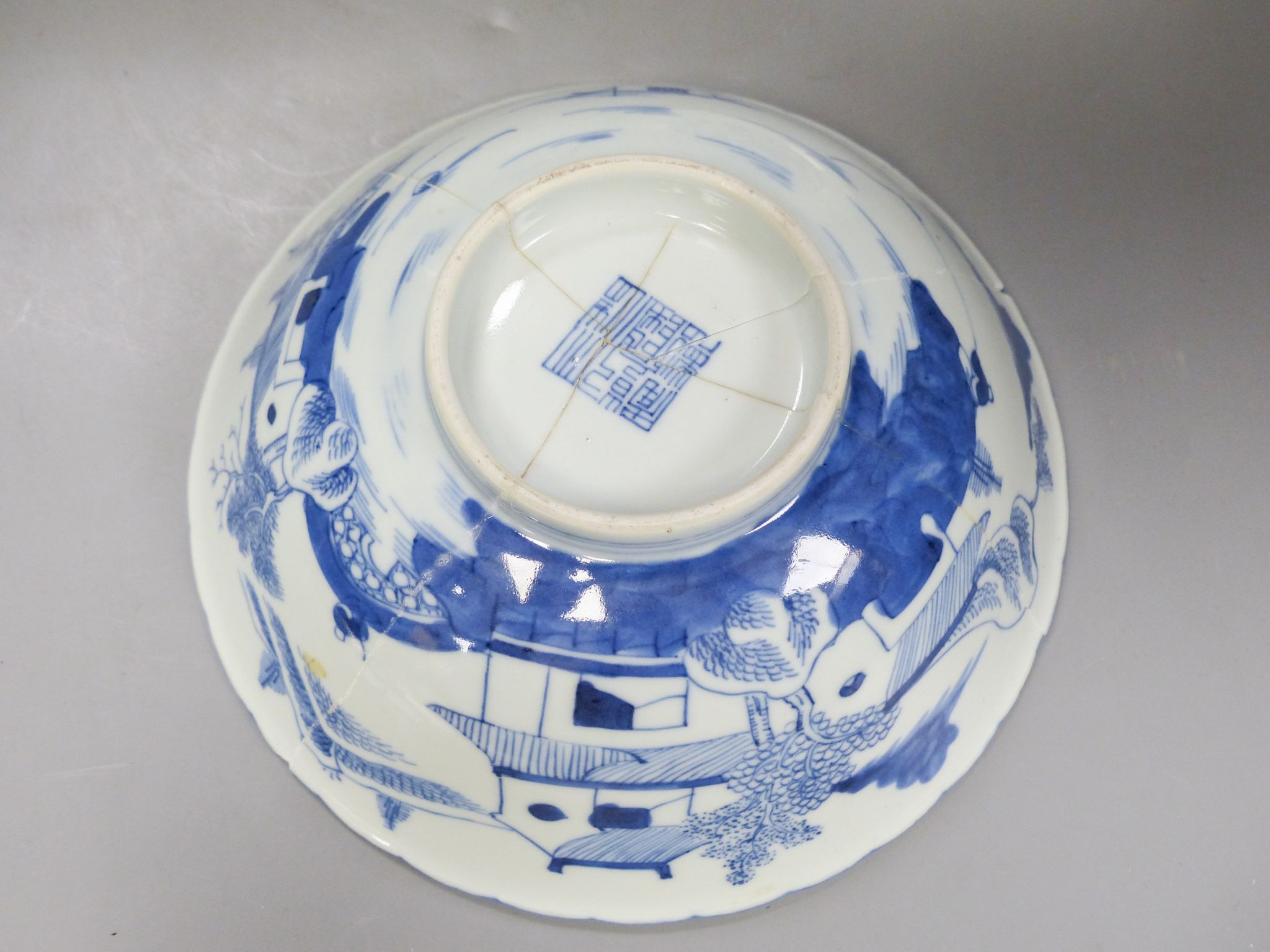 A Chinese blue and white landscape bowl, a/f and a Chinese blue and white ‘dragon’ dish, 18 and 16.5 cm